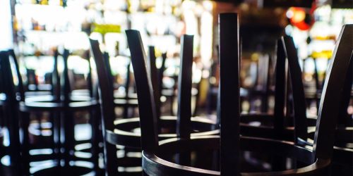 Bar interior at closing time highlighting challenges from rising liquor liability insurance costs