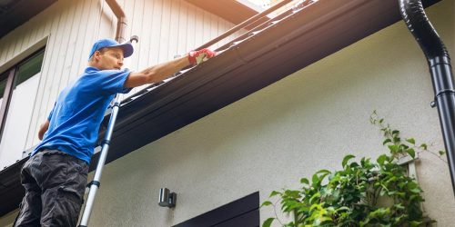 Property owner performing spring maintenance to reduce liability and property damage risks